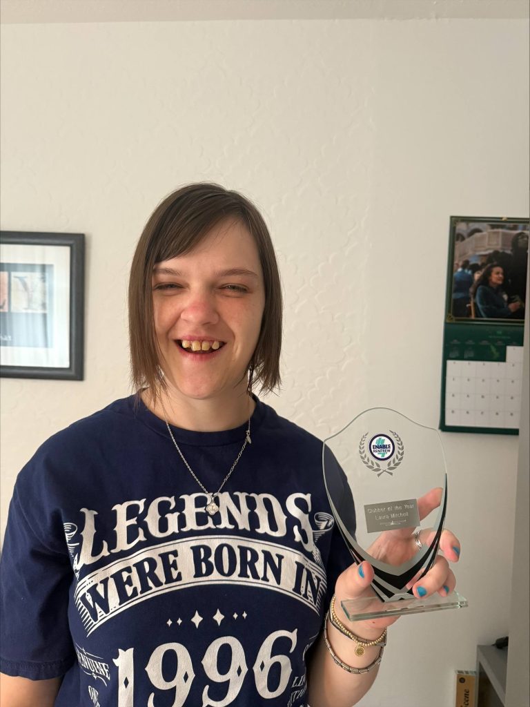 Laura winning an award